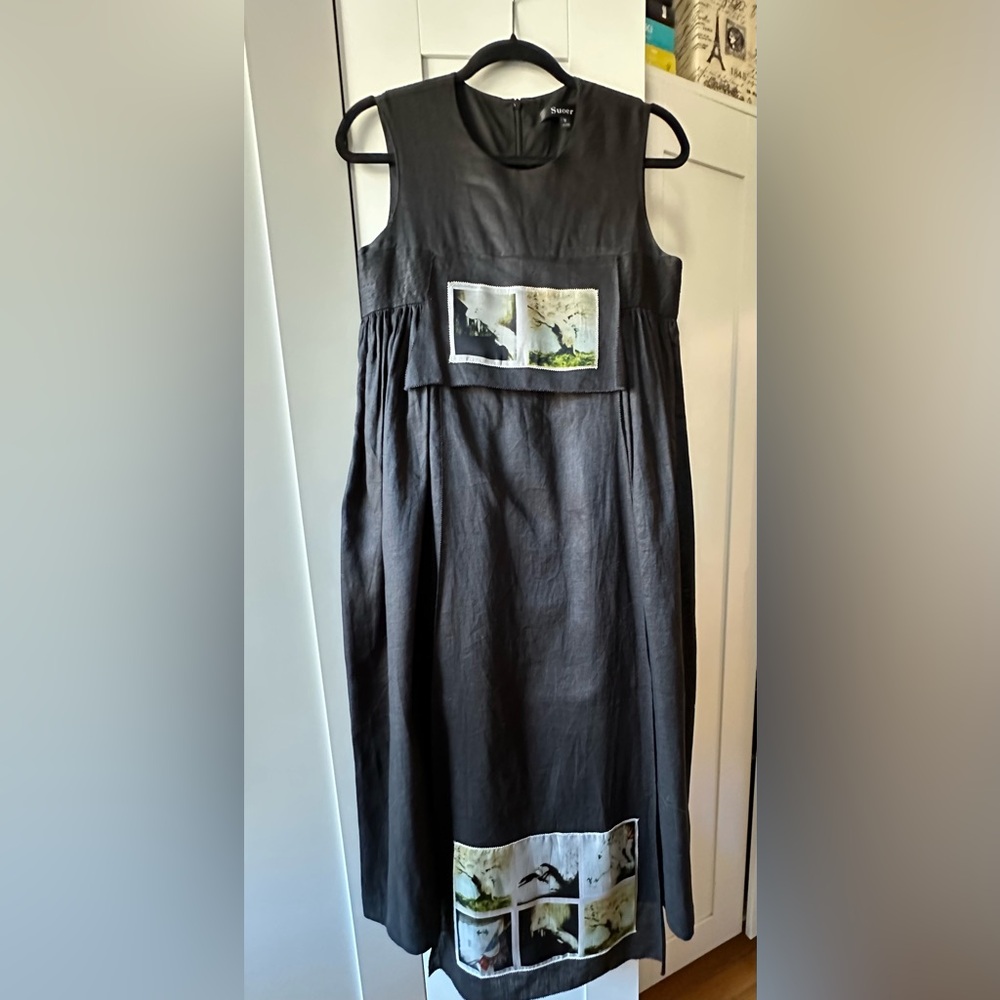 Original black dress with layers and picturesque appliqués